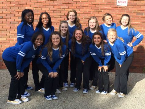The 2014-15 K-Motion dancers pose before the Homecoming parade.