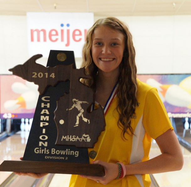Junior Hannah Ploof poses with the state championship trophy after last years state final.