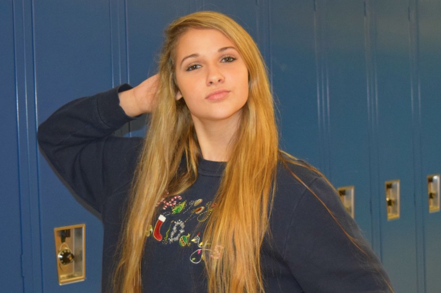 Senior Angie Greer poses in her ugly Christmas sweater. Greer is proud to show it off at school.