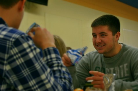 Junior Noah Jankowski talks with his friends at lunch. 