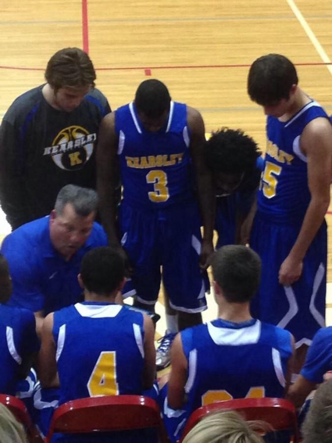 Coach+Paul+Adas+talks+strategy+in+the+huddle.+The+Hornets+came+back+from+a+19-point+deficit+to+beat+Swartz+Creek.+