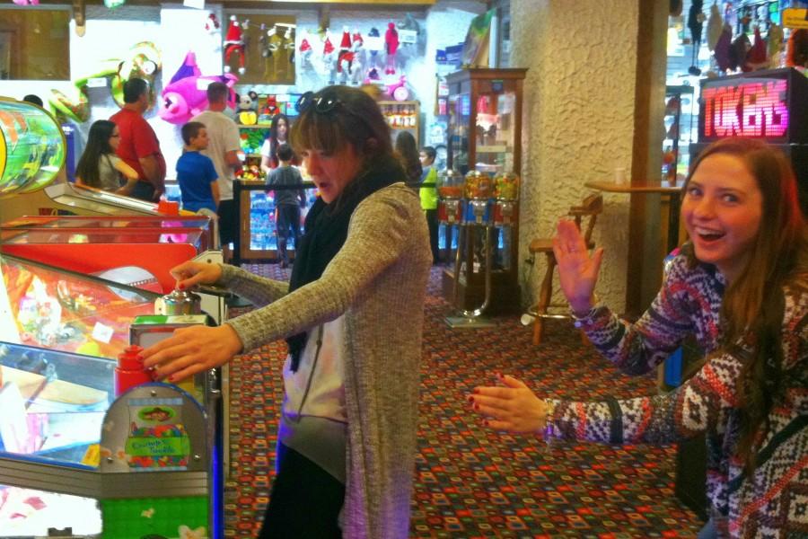 Student Council Communications Officer Karmen Bishoff (left) and President Hannah Smith play a game at the Bavarian Inn during the Student Council Christmas party.