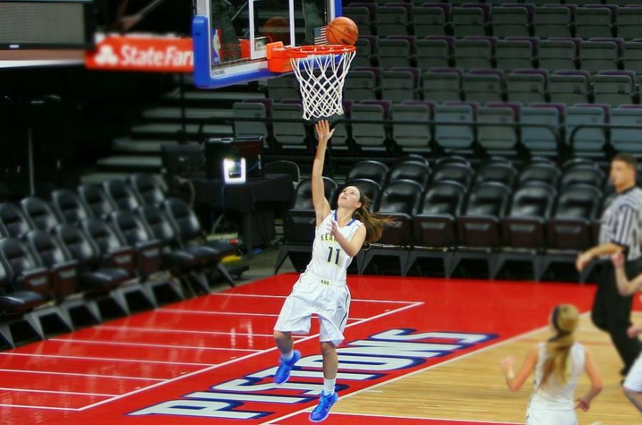 Brandi Morgan, sophomore, shoots a layup against LakeVille at The Palace of Auburn Hills.