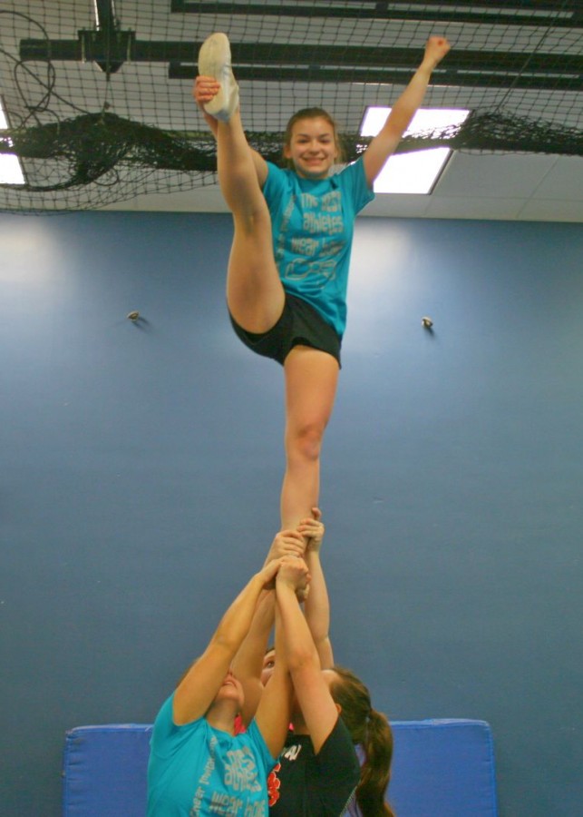 Sophomore Kassidy Krist hits a heel stretch. 