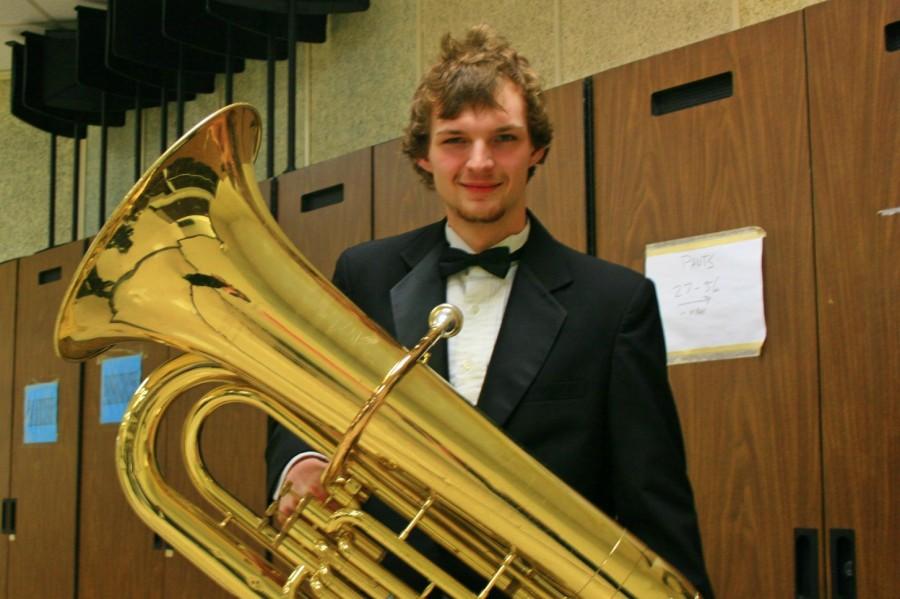 Senior Travis Perakovic  poses with his tuba after the band concert on March 5. 