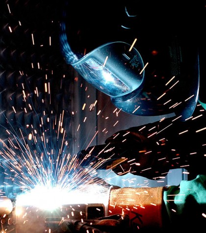A man is gas metal arc welding.