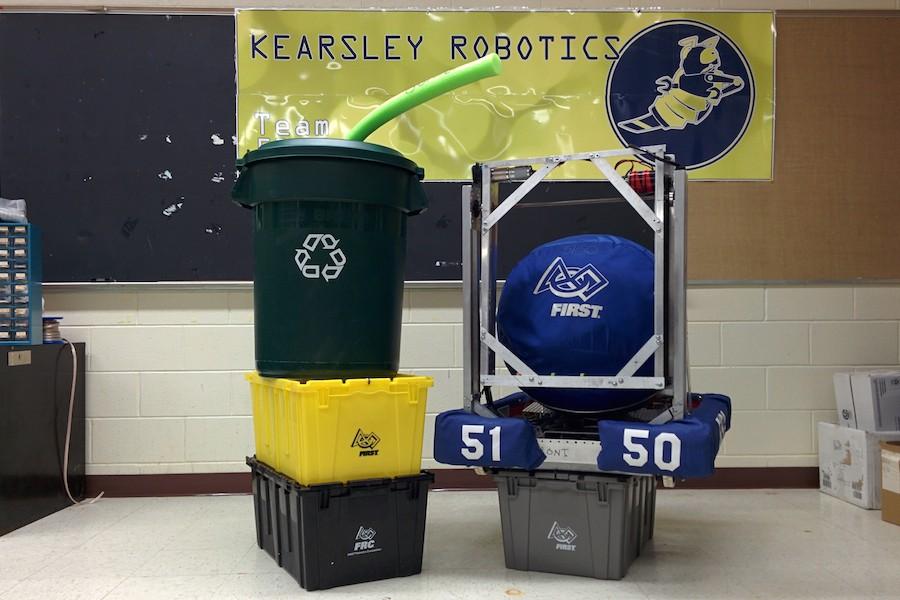 This years game is illustrated by a recycling container with litter (pool noodle) stacked on top of two totes.  Last years robot (right) accomplished the task of manipulating the ball shown in the bot.