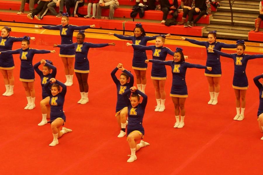 The cheer team hits a motion during round one at the regional competition on Feb. 28. 