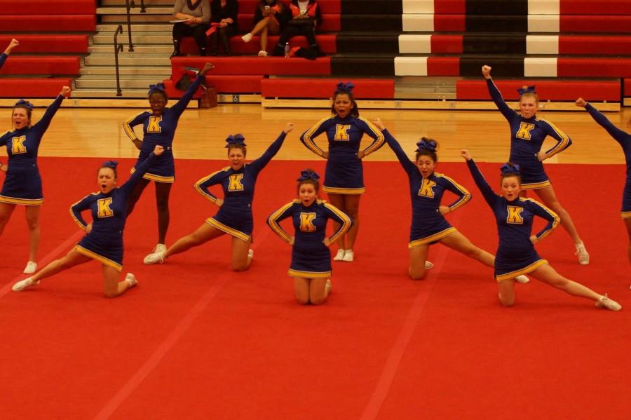 The cheer team hits a formation during round one of competition on Feb. 11 at Linden.