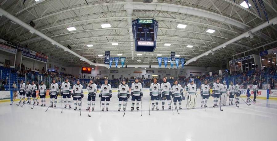 The Plymouth Whalers line up on the rink. 