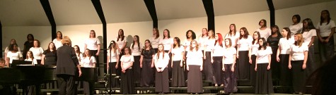 The Women's Chorus take the stage, singing "Yonder Come Day" by Judith Cooke Tucker.