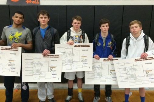 The individual league champions from Kearsley show off their brackets. The wrestlers are (l to r) James Davis, Dylan Terrance, Travis Wildfong, Jakob Chapman, and Andy Ruhstorfer.