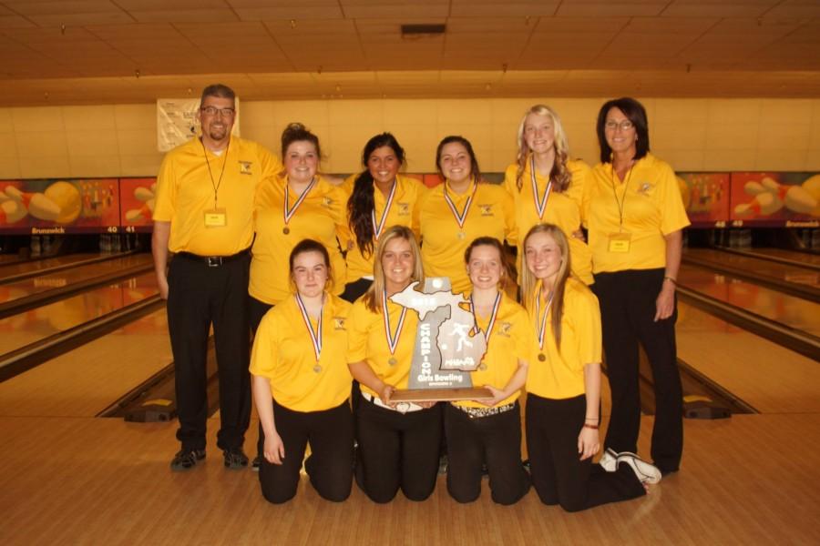 The girls bowling team poses with their first-place trophy at the Division 2 state final on March 6.  