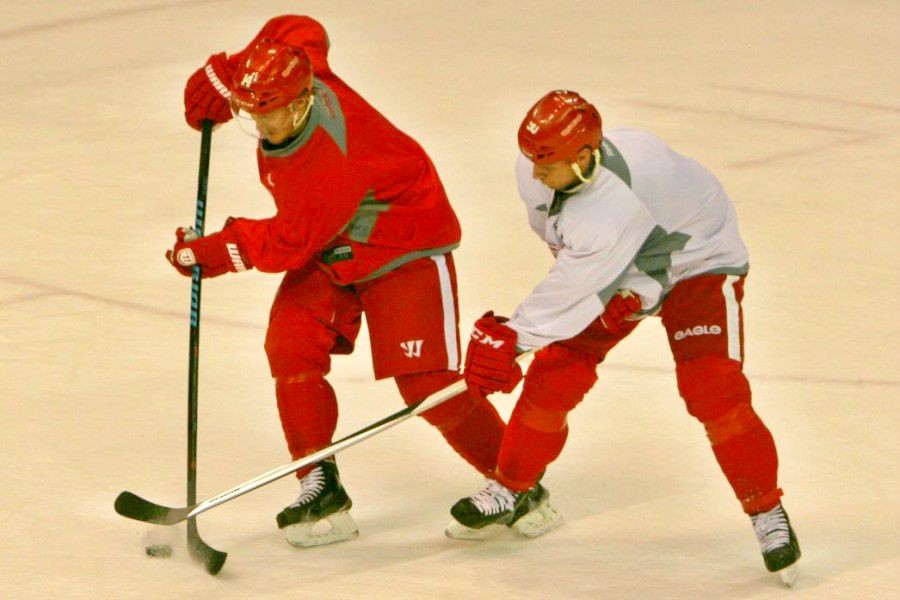 Red Wings players fight for the puck during practice at Joe Louis Arena on Feb 13.