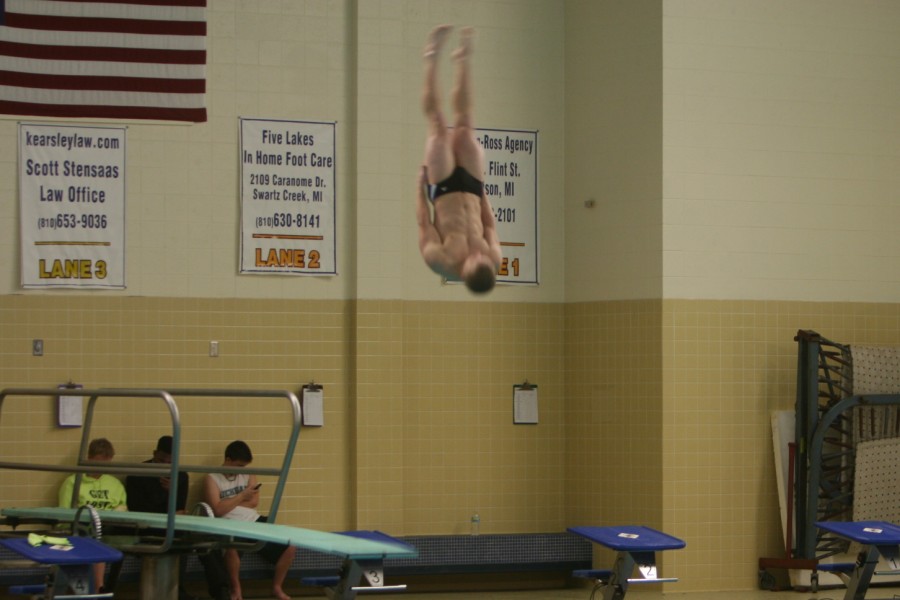 Senior Brendan Evenson dives at the Swartz Creek-Flushing dual meet on Feb. 3. Evenson finished 15th in diving at the MHSAA regional meet on March 5.