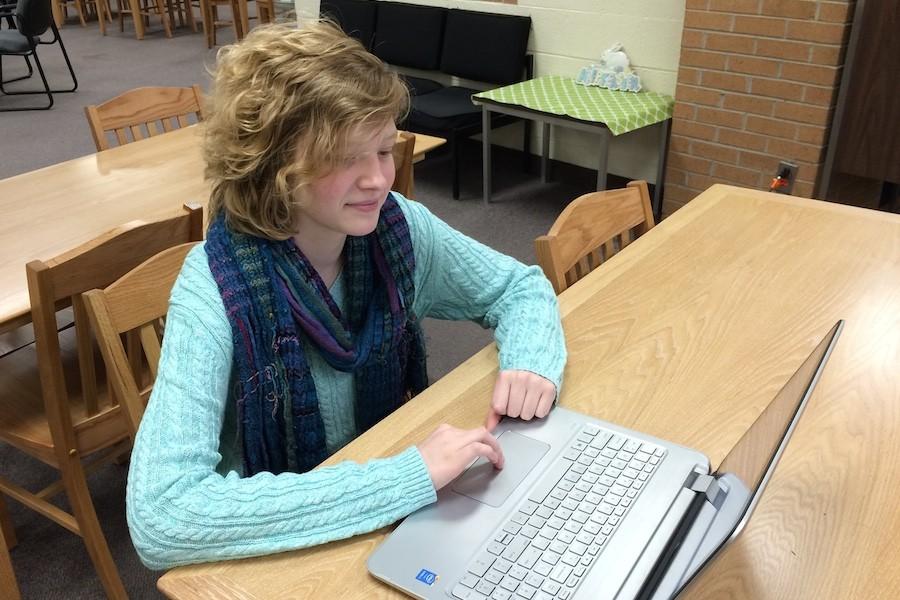 Senior Raven Cantrell enjoys using her laptop to play games on the Internet.
