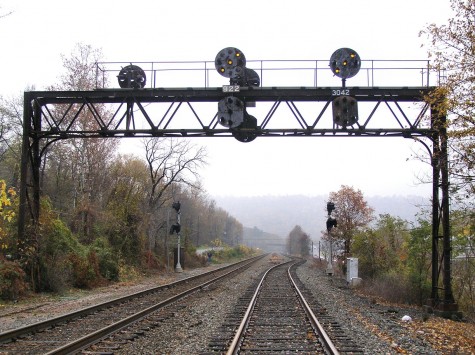 PRR signal bridge at MP 304 on the Buffalo Line on the Pennsylvania Railroad lit up for an approaching train. 