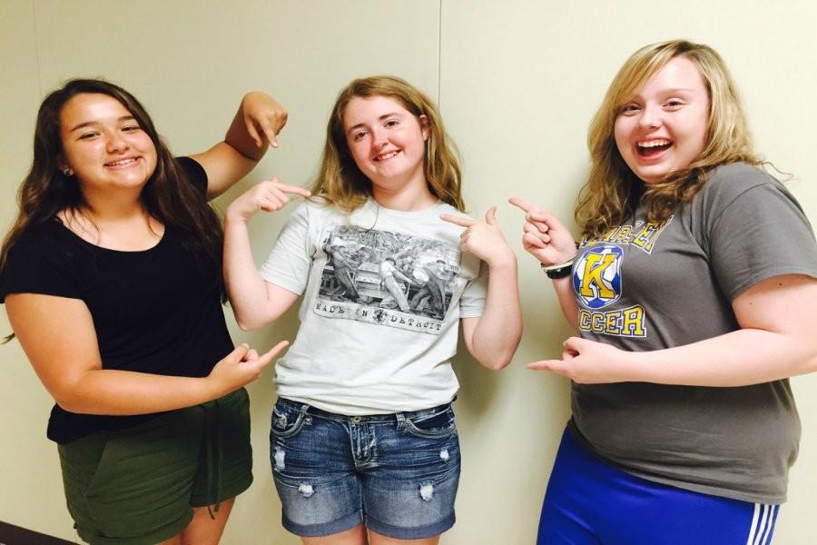 Juniors Aysia Booth (left), Kayla Smith, and Katie Valley show off Smiths Detroit Institute of Arts T-shirt.