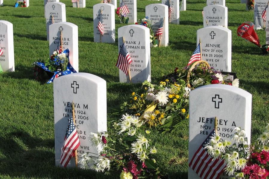 U.S. servicemens graves are adorned with U.S. flags on May 28, 2006, at Fort Logan National Cemetery in Denver, Col.