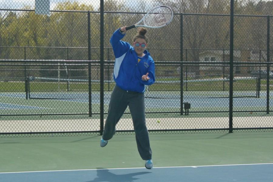 Junior Aysia Booth warms up for her match against Swartz Creek on April 30. Booth and her partner junior Makenzie Schroeder won their match at No. 2 doubles. 
