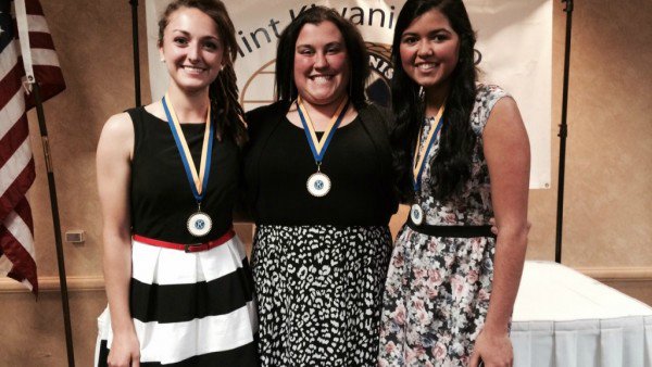Seniors Mackenzie Chappell (left), Kaitlin Dormire, and Kayla Emmendorfer were honored by the Flint Kawinis as scholar-athletes on May 21 at the Genesys Conference Center.