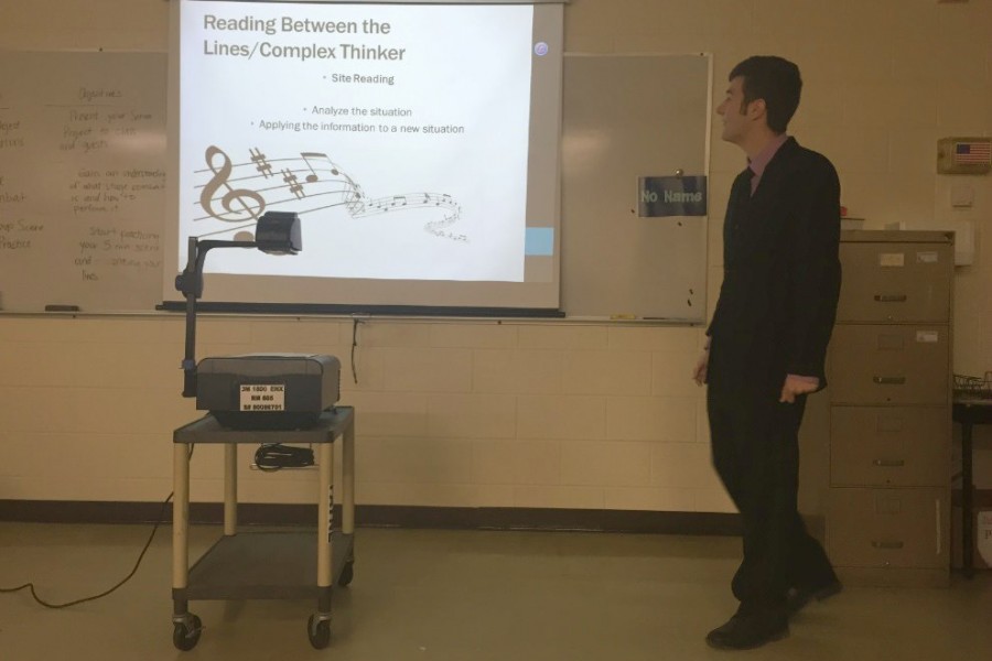 Senior+Noah+Pfeifer+demonstrates+how+to+sight+read+sheet+music+as+his+complex+thinking+skill+for+his+senior+project.