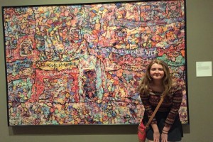 Kayla Smith poses in front of her favorite painting at the DIA.