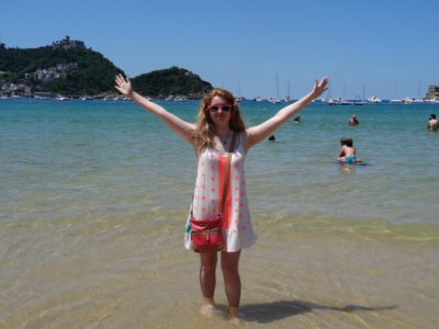 I stick my toes in the Atlantic Ocean at beach in San Sebastian.