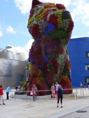 I pose in front of the giant flower-dog.