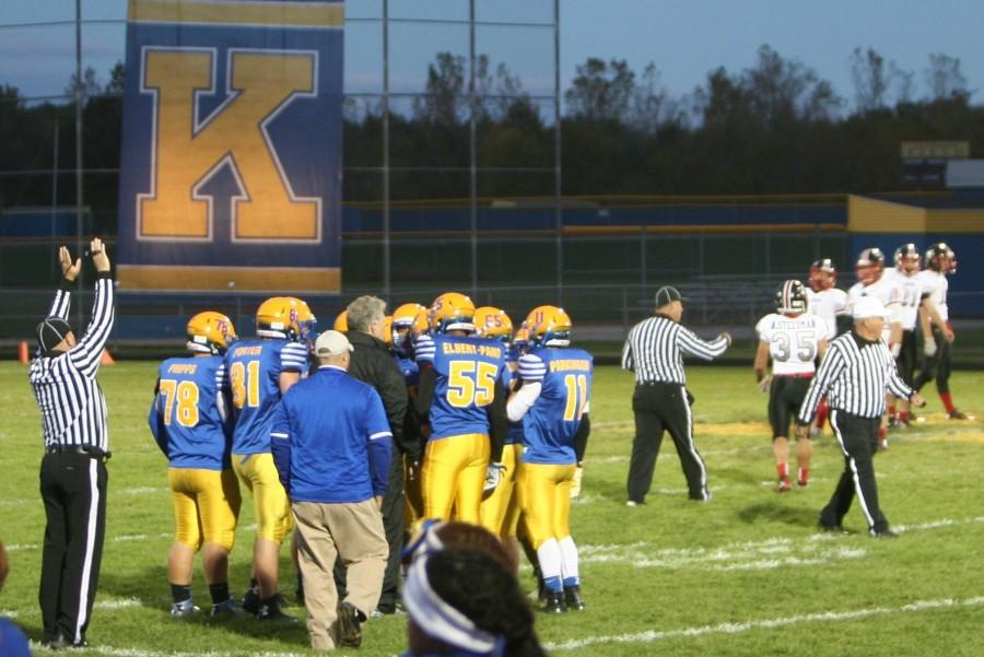 Coach Jeff Putnam talks to the Hornets during the homecoming game Friday, Oct. 9 against Linden.