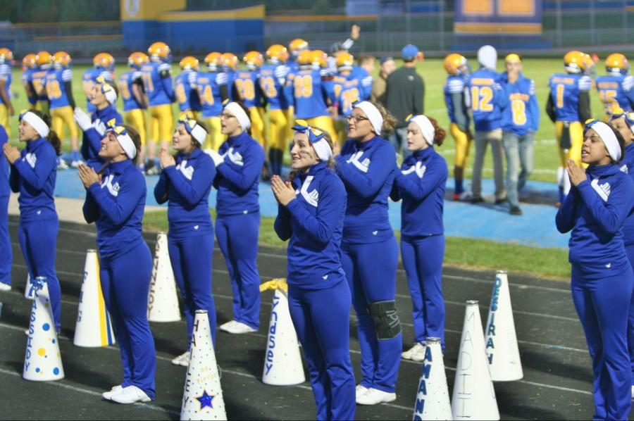 The cheerleaders lead the spirit at the homecoming game Friday, Oct. 9.