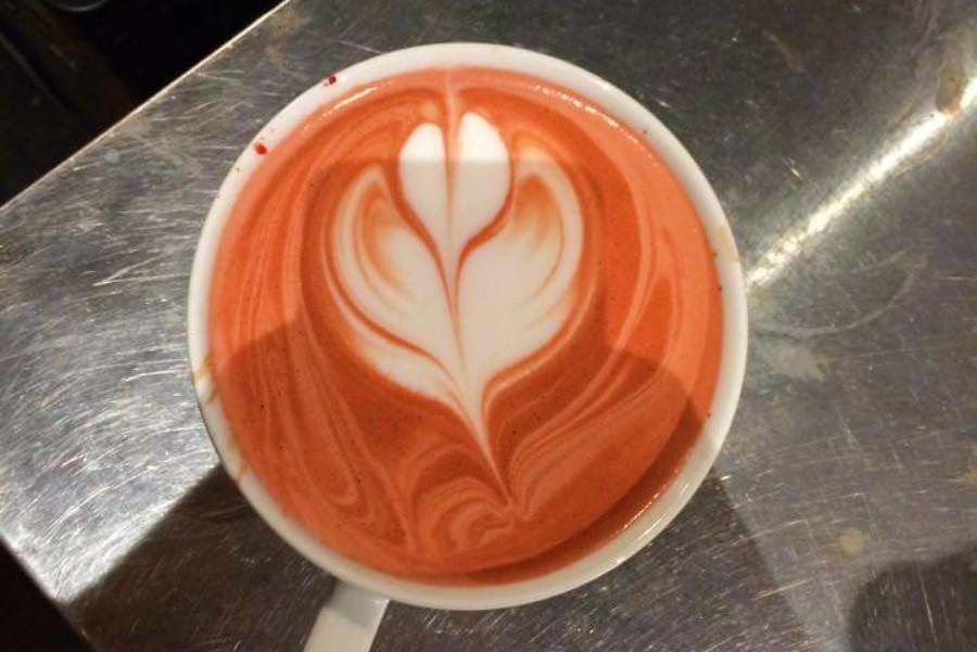 Senior Jacob Moore works at Café Rhema, making latte art.