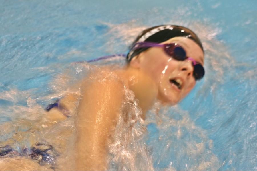 Junior Alexis Schwartz races in the 200-yard freestyle relay at Swartz Creek on Thursday, Oct. 15.