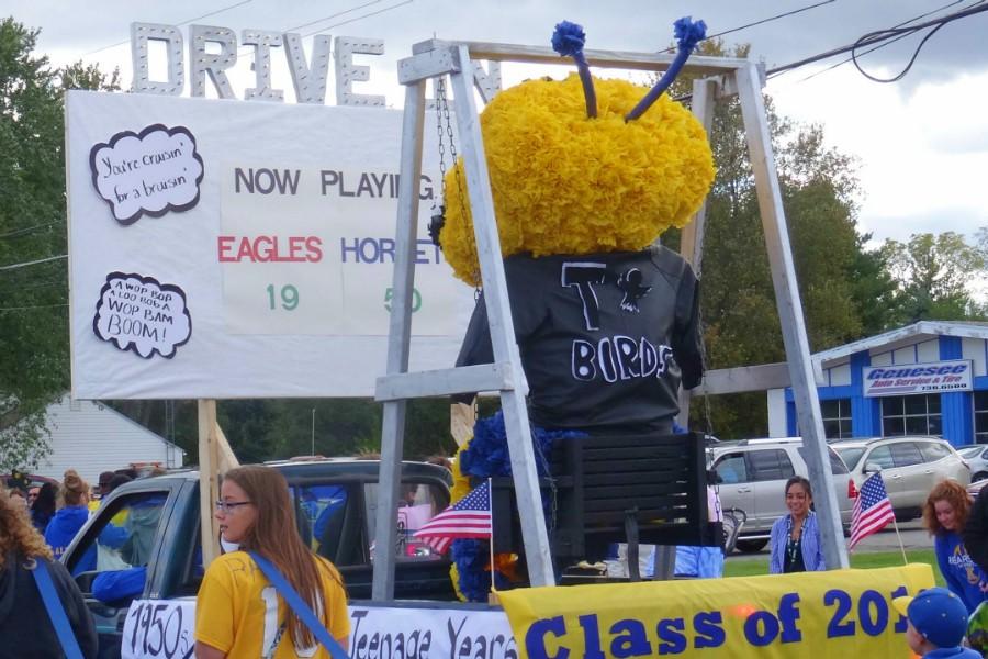 The Sophomore Class float shows the hornet watching the game at a drive-in.