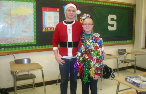 Sophomores Kyle Menger and Alexis Fidler show off their Christmas sweaters this season