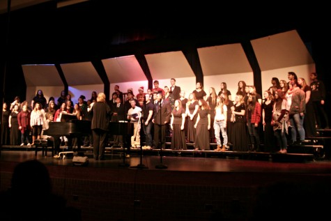 The A Capella Choir, along with choir alumni, sing "Sleigh Ride."