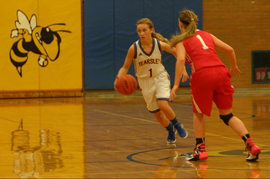 Senior Diane Bond brings the ball up the court against Swartz Creek on Friday, Dec. 11.   Bond led the Hornets on offense in their loss.