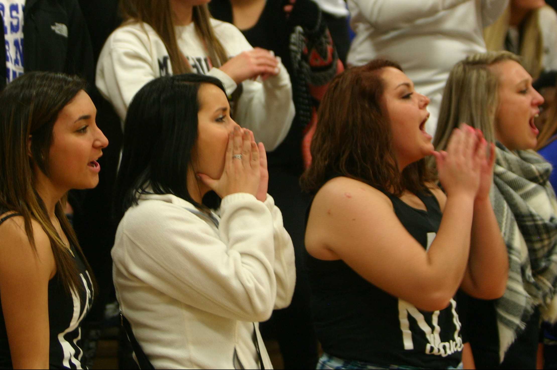 The student section cheers for the Hornets during the Swartz Creek game on Friday, Dec. 11.