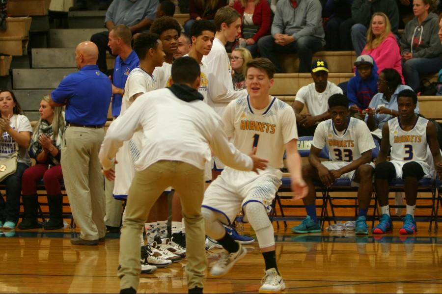 Junior Chandler Ford (1) is introduced as a starter before the Kearsley-Swartz Creek game on Friday, Dec. 11. Ford led the Hornets with 13 points.