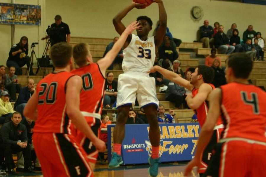 Senior Deitrick Young goes up for a jump shot against Flushing on Friday, Dec. 18.