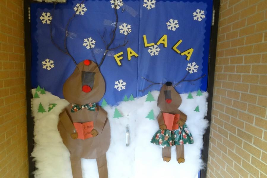 The choir room's door has singing reindeer.