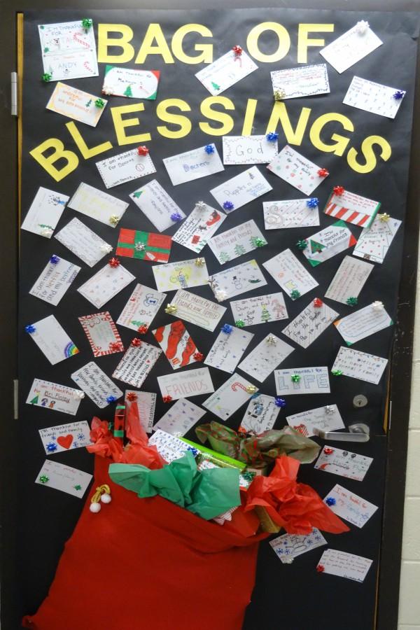 Mrs. Kandy Cousins has a bag of blessings on her door.