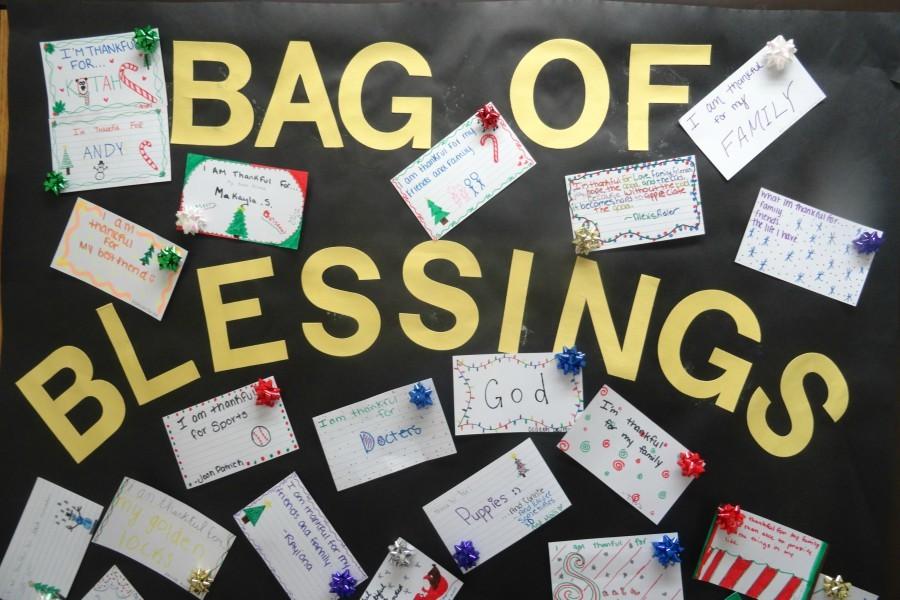 Mrs. Kandy Cousins has a bag of blessings on her door.