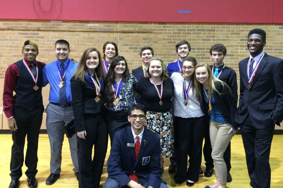 DECA members pose at the district competition held on Thursday, Dec. 17, at Saginaw Valley State University.