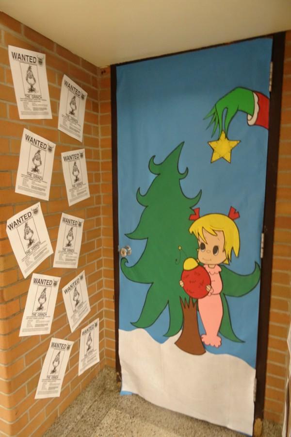 Mr. Chris Torok captures a scene from "Dr. Suess' How the Grinch Stole Christmas" in his door.