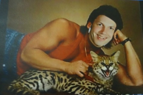 Mr. Greg Golembiewski lounges with his feline friend. 