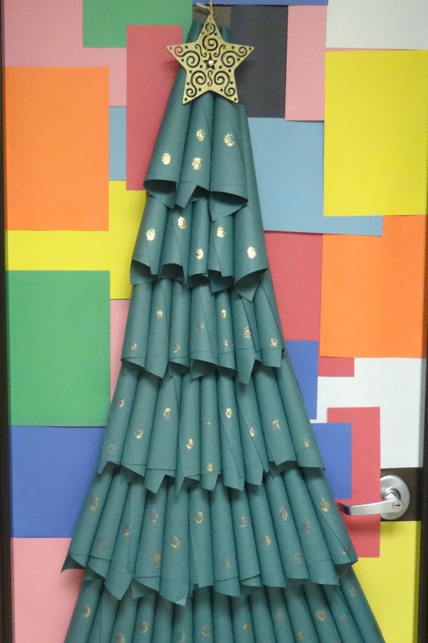 Shaw also decorated her other door with a colorful background and a Christmas tree.