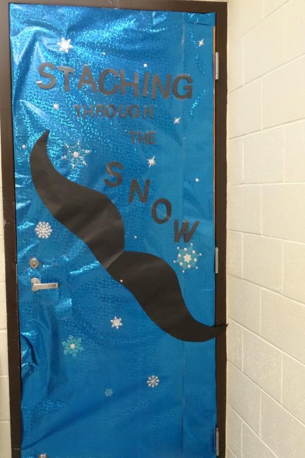 Mr. Mike Simms' door features a mustache.