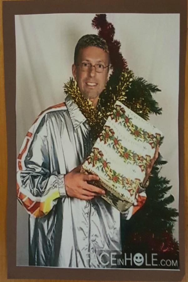 Mr. Chris Torok is excited to open his present on Christmas morning.