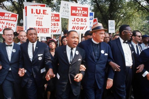King, along with leaders at the March on Washington for Jobs and Freedom link arms in front of marchers.